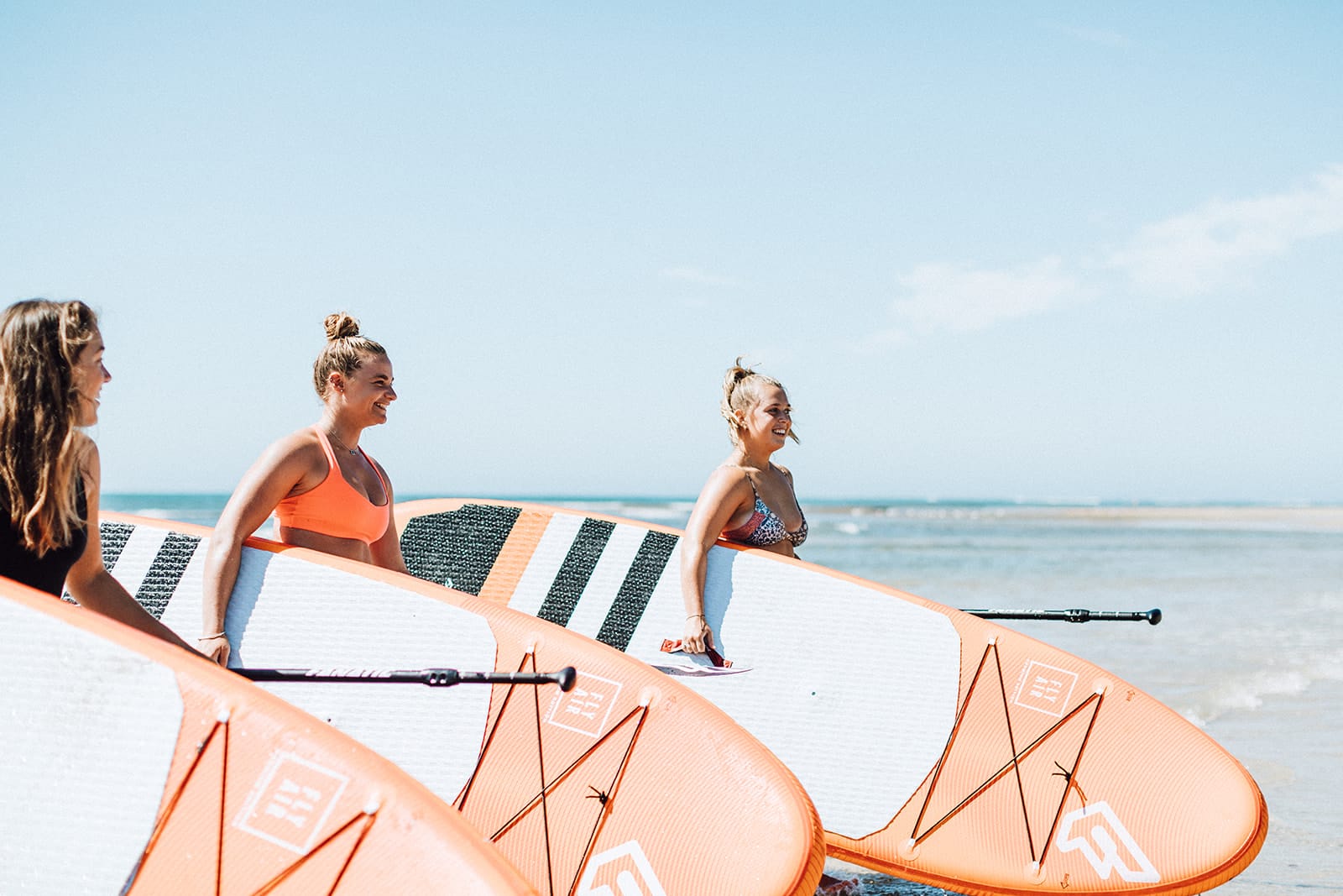 Teens stand up … in the surf!