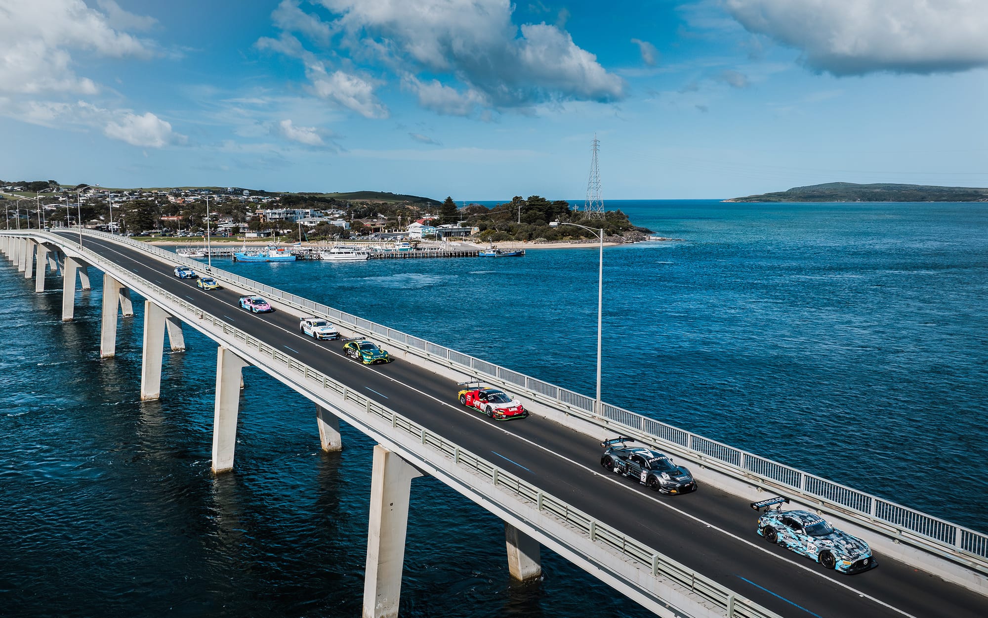 GT cars cross bridge and enter Phillip Island in style