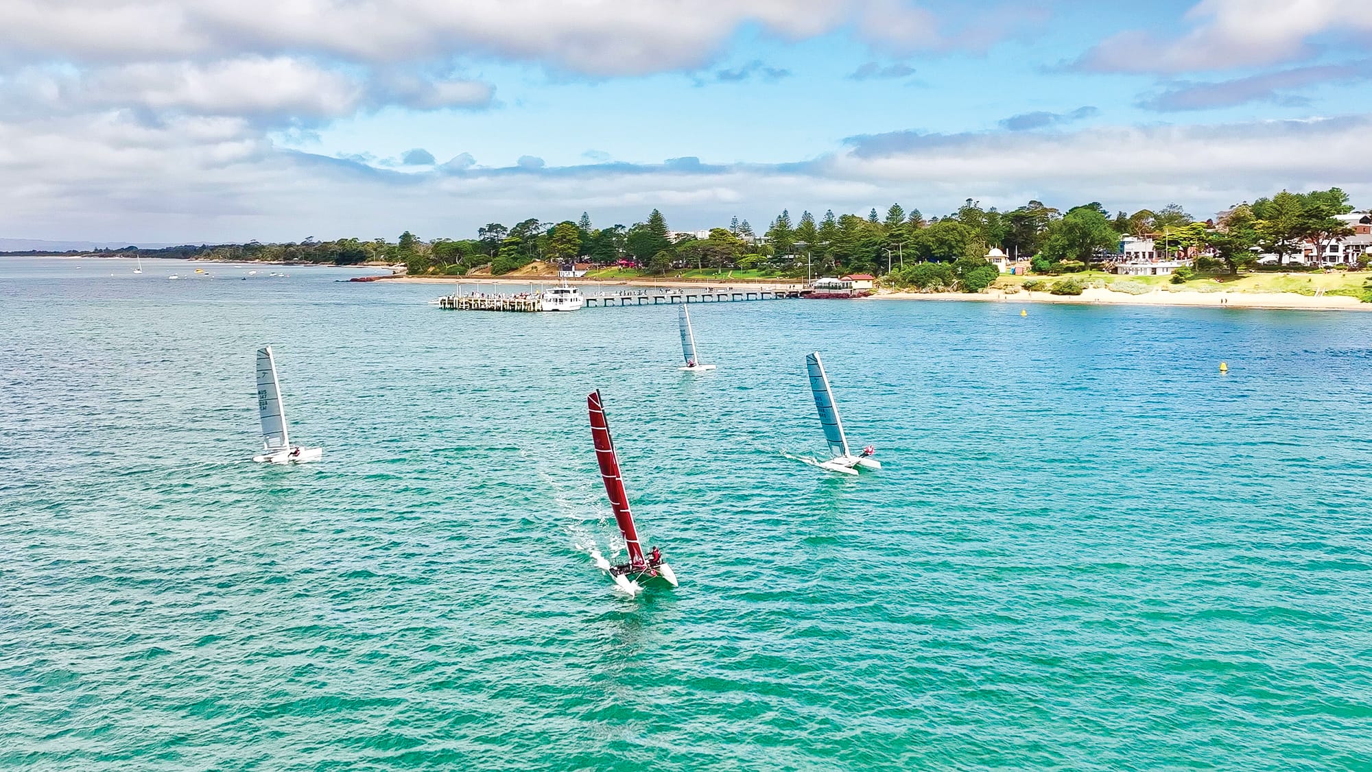 Catamarans racing towards Cowes