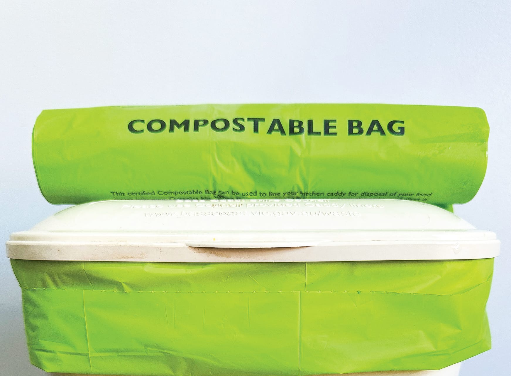 Purple bins in, green compostable liners out