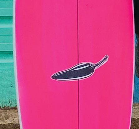 Red handed thief makes off with hot pink board