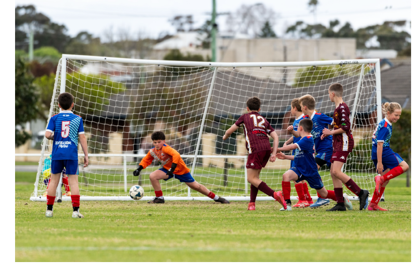 U12A Henry Kennedy diving for the ball.
