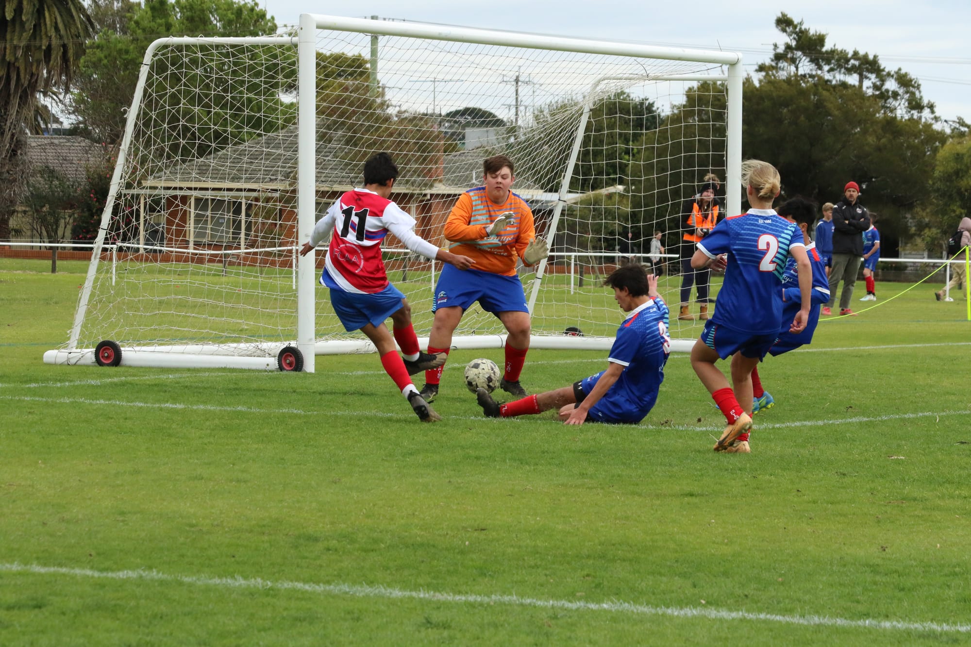 Judd Bland (Goalie), Nash Adams (Captain), Hannah Titmarsh and Zach Coldora in action.