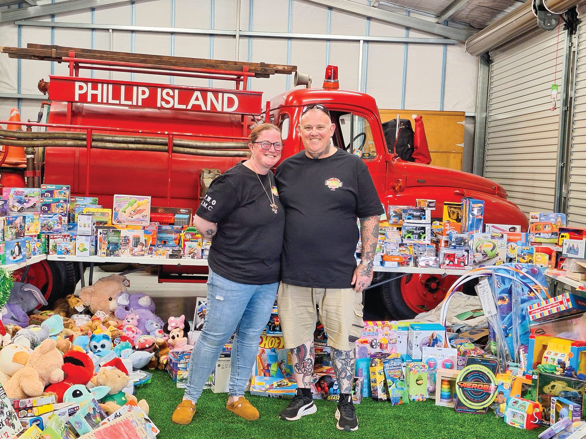 Organisers Samantha and Jason Hampstead of Dead4Eva Designs with some of the toys generously donated by this year's Toy Run. Photos courtesy of Samantha Halstead, Dead4Eva Designs.
