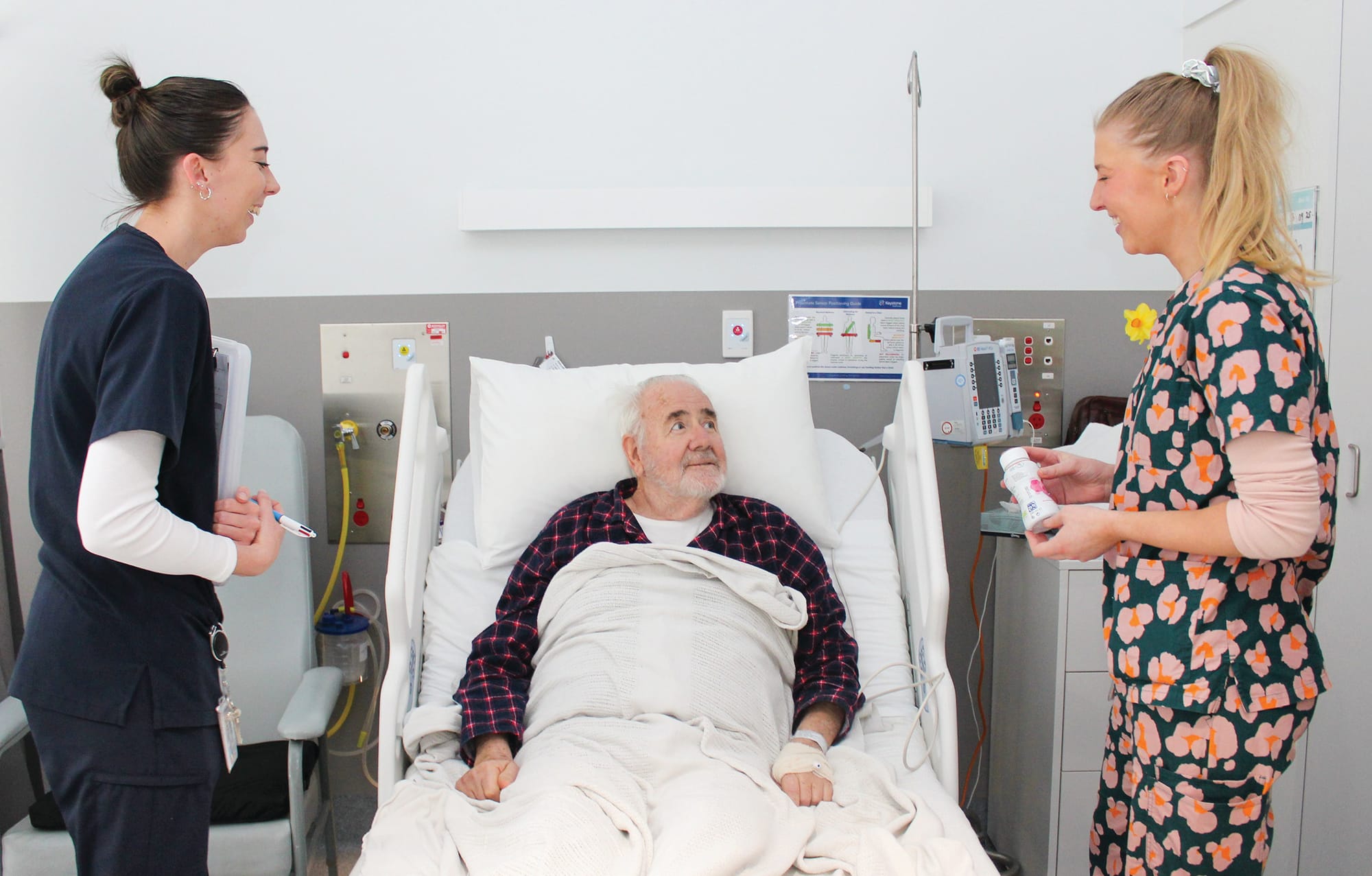 
Patient David Paul receives advice from Speech Pathologist Hannah Sparkes and Dietitian Emily Walsh at Armitage House sub-acute ward at Wonthaggi Hospital.