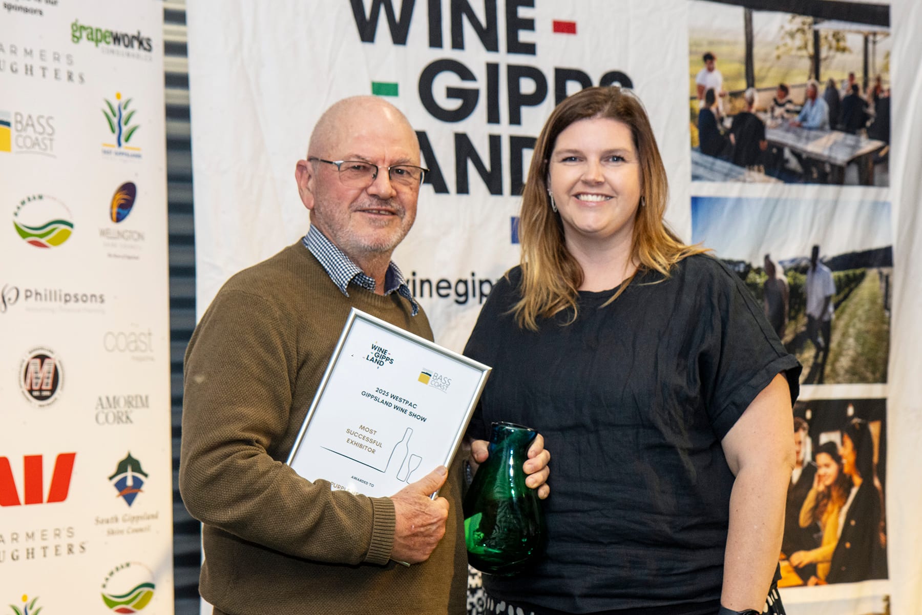 Rick Lacey accepts the Most Successful Exhibitor Trophy from Lauren Van Strijp of Bass Coast Shire Council.