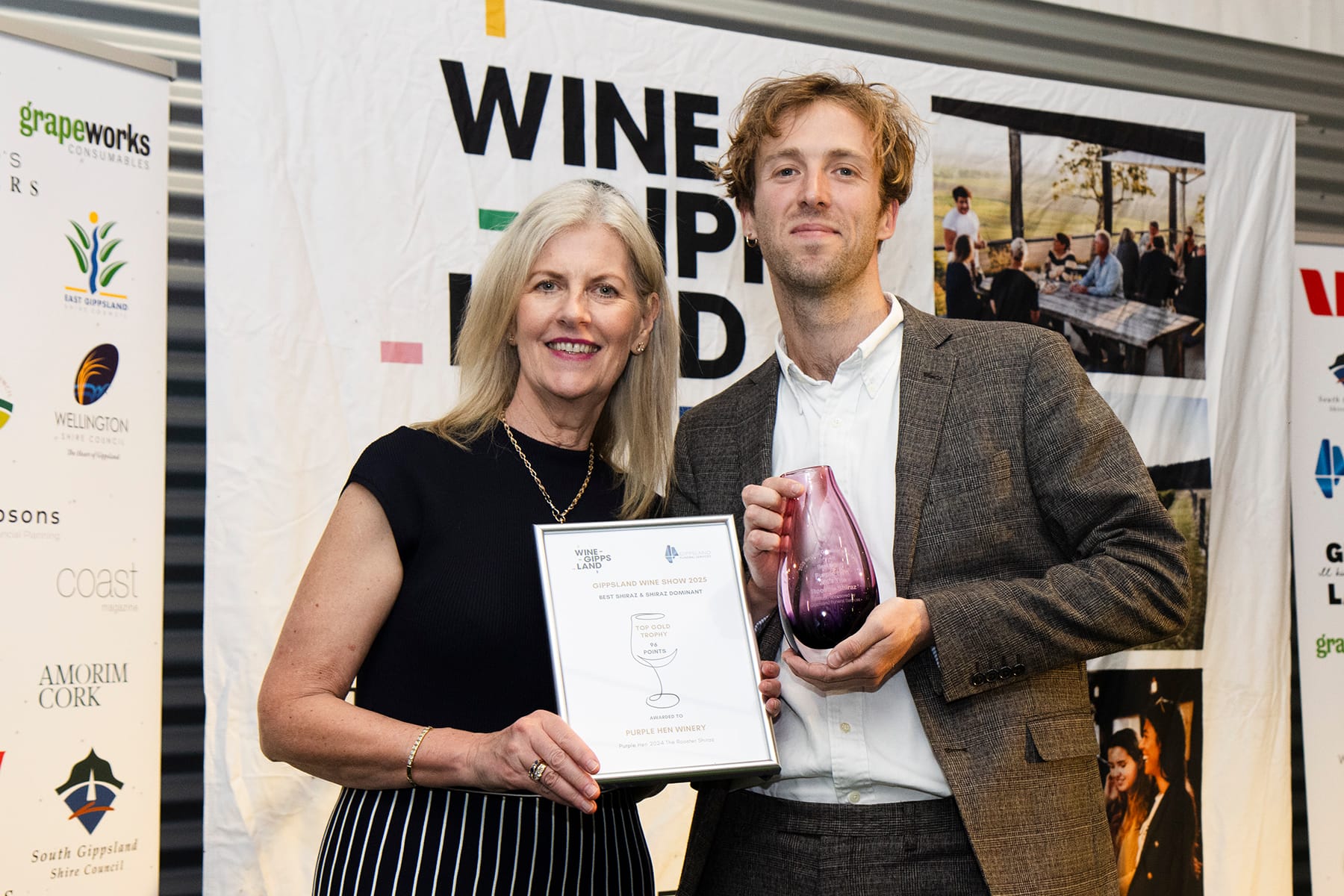 Caroline Rossetti of Gippsland Funeral Services presents the trophy for Best Shiraz to Dominic Kearton for the Purple Hen 2024 The Rooster Shiraz.
