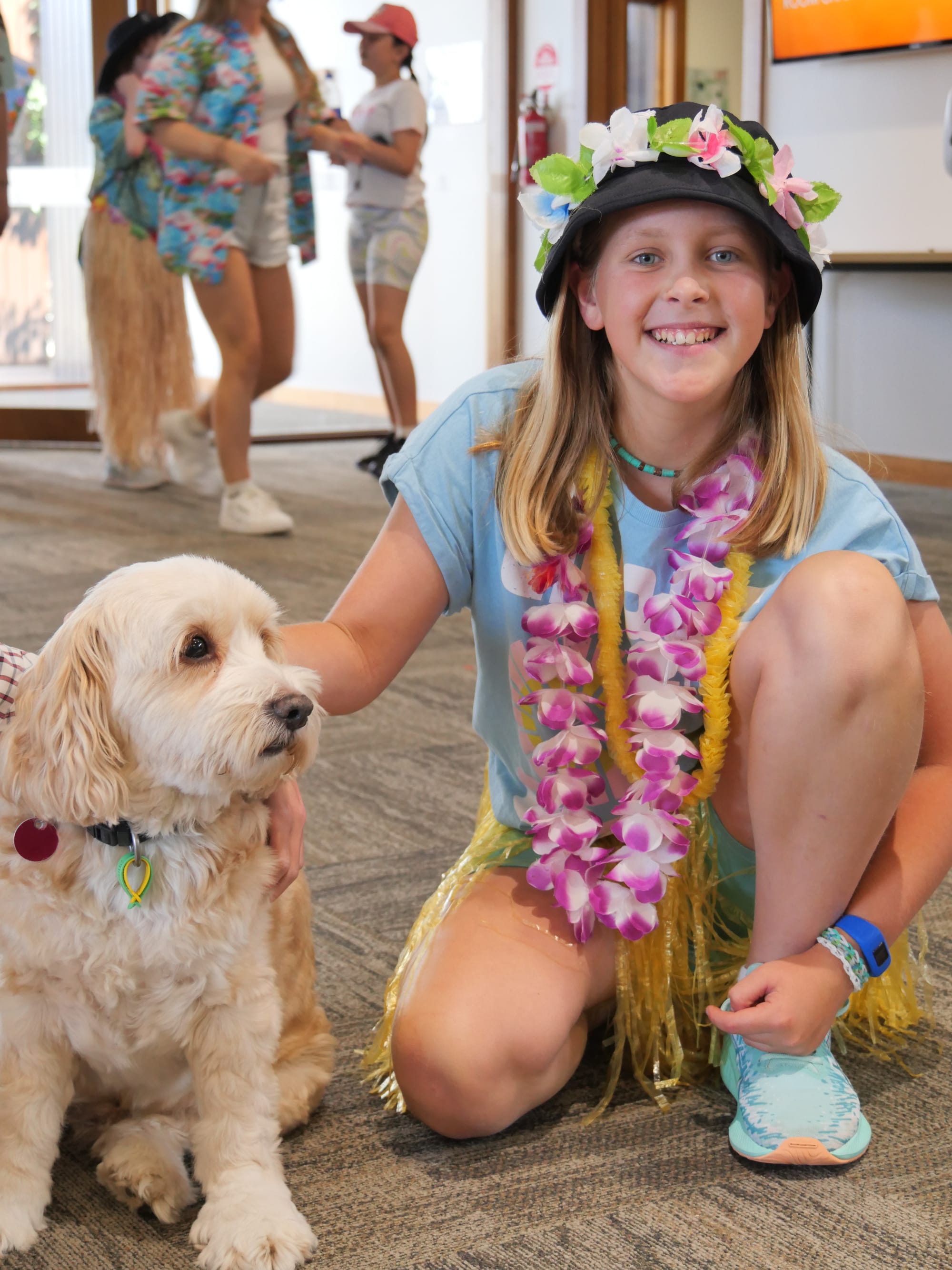 Newhaven College's fundraising Tropicana dress up day was hugely popular. Year 5 student Ava Mannix shared the fun with local identity Harvey.