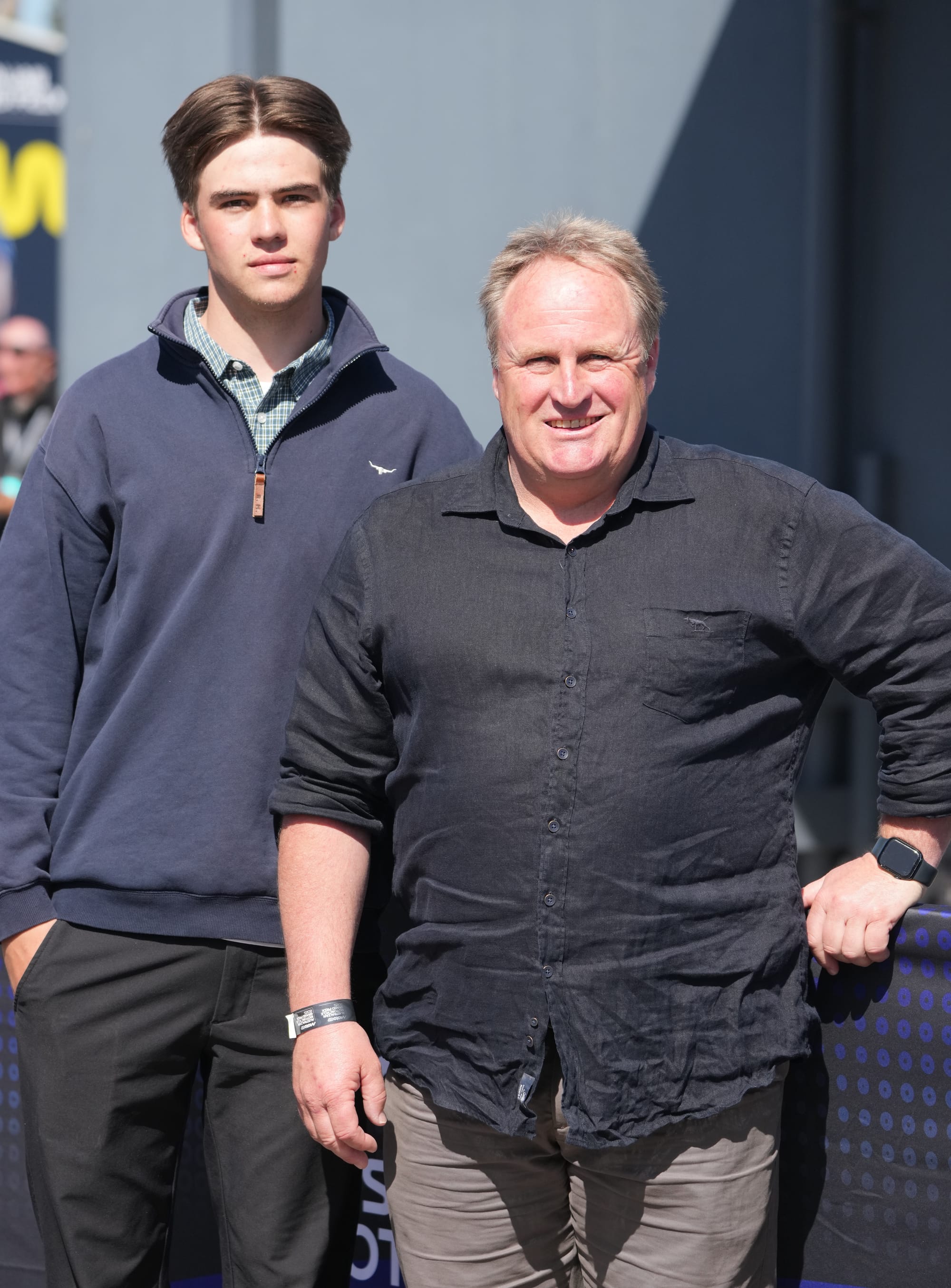 PIFNC President Chris Ross (right) with his son Archie, at the MotoGP. Photo: Nici Cahill, Snapshot Photography.