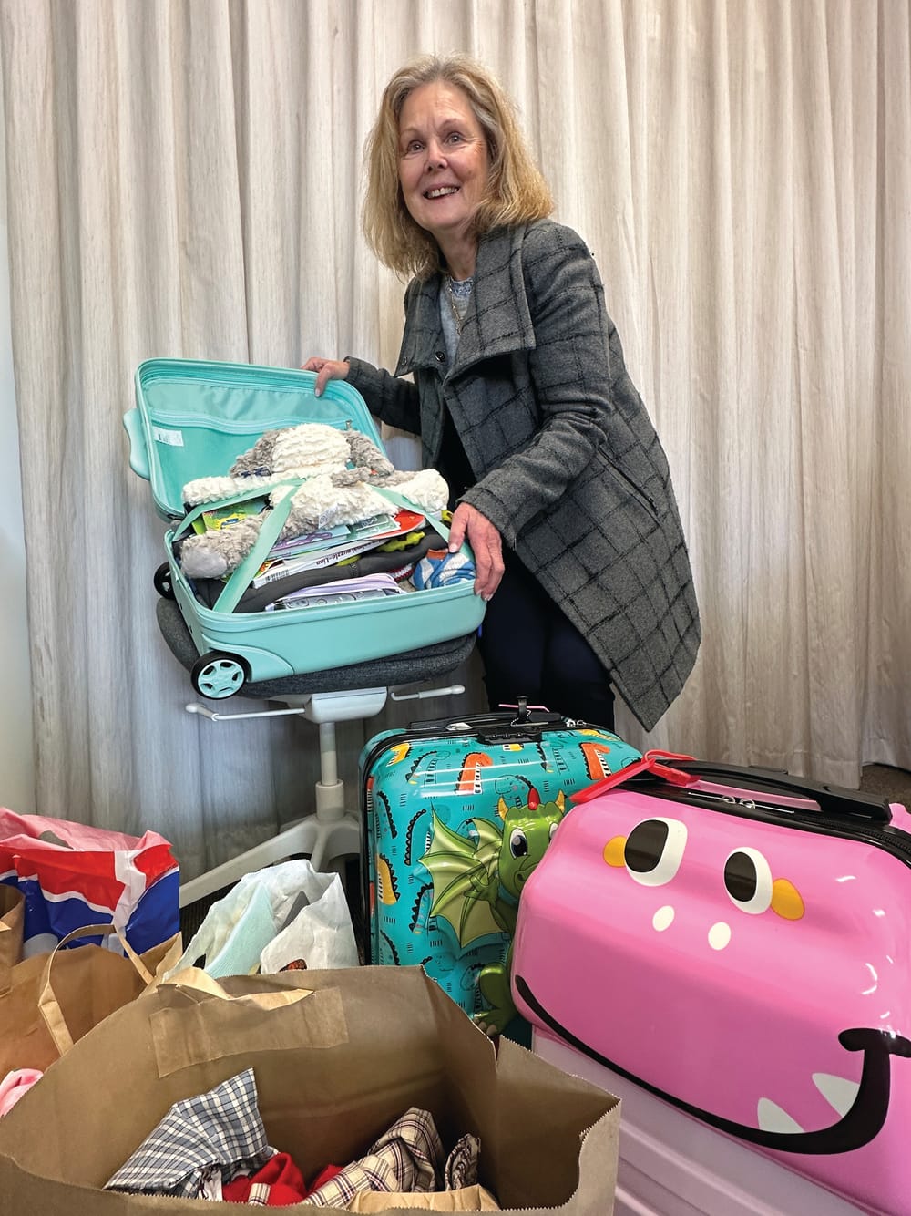 Suitcases overflowing with care post image