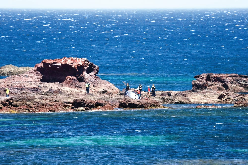 Close calls as island swelters post image