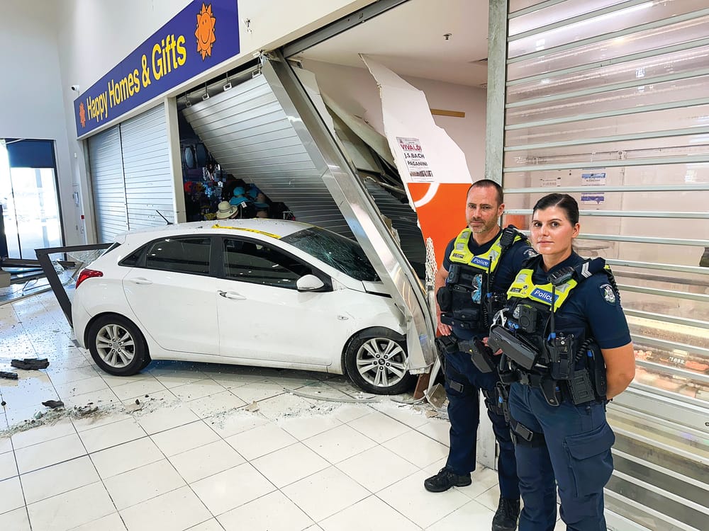 Car smashes Woolworth's Plaza, two shops post image