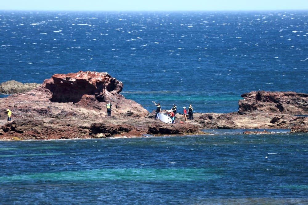 Two close calls as island swelters post image
